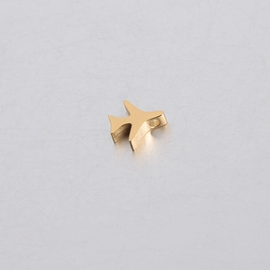 Detail van een gepolijste gouden roestvrijstalen vliegtuigbedel met een gat van 1,8 mm