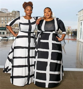 Detail of high-waisted striped maxi dress with black and white print and five-point sleeves