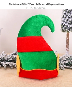 Detailed view of red and green striped plush elf hat with cute yellow ears and bell trim