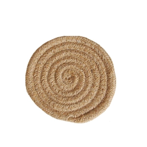 Close-up of a round jute woven coaster showing natural fiber textures and spiral pattern