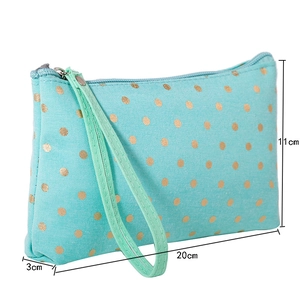 Detail of mint green dotted travel makeup bag showing precise 20x11x3 cm dimensions