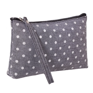 Portable gray fabric cosmetic bag with white polka dots and zipper handle design