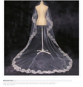 Detailed close-up of 3-meter single-layer white bridal veil with intricate lace floral edges