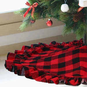 Detail of red and black buffalo plaid Christmas tree skirt with ruffled edge design