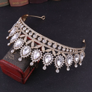 Detail of baroque bridal crown with golden alloy and sparkling white water-drop crystals