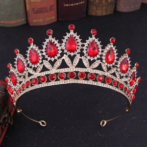 Detailed macro view of luxury baroque golden crown with red crystals and rhinestones