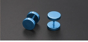 Macro shot of blue barbell stud earrings with polished steel finish on grey background