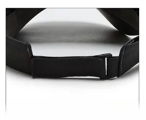 Detailed view of adjustable strap and breathable mesh fabric on black sun visor hat