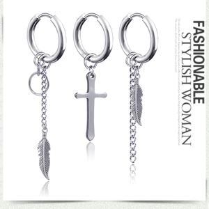 Three-piece silver steel earring set with cross and feather chain charms on white background