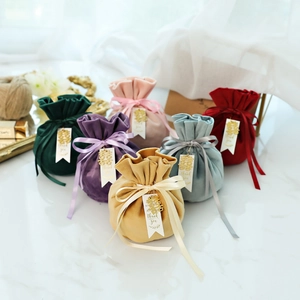 Velvet wedding favor bags with 'Thank You' tags in multiple colors for bridal gifts