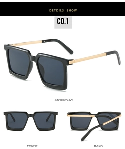 Detailed side view of square black sunglasses with slim gold metal temples and UV lenses