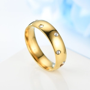 Macro detail of 18K gold plated stainless steel ring with micro-set cubic zirconia stones