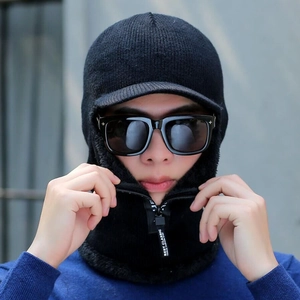 Detail view of black knitted winter hat with integrated neck warmer and soft fleece lining
