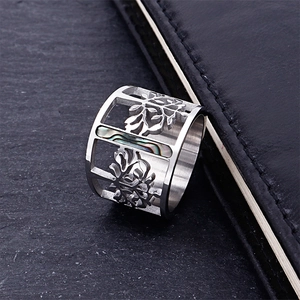 Silver stainless steel wide band ring featuring hollow tree design and abalone shell inlay