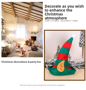 Detail of red and green striped Christmas elf hat with yellow fabric ears and plush ball