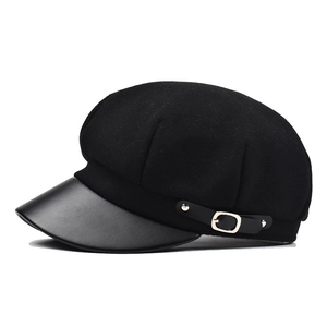 Classic black newsboy cap with wool blend crown and stylish faux leather brim design