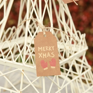 Mini brown kraft paper Christmas tag with Merry Xmas text and cute red glove patterns