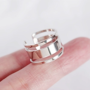 Close-up of S925 sterling silver triple-layer minimalist open ring worn on finger
