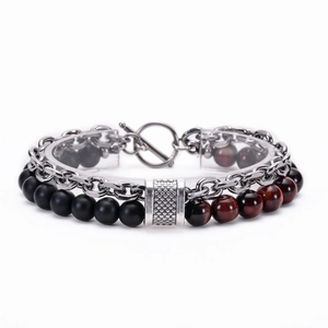 Detail of double-layer bracelet with black and tiger eye beads plus silver chain link