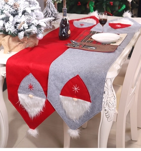 Detail showing red and grey Christmas gnome table runners with 3D plush beard accents