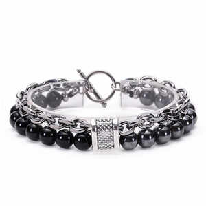 Detail of double-layer men's bracelet with black onyx, hematite beads and metal chain