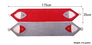 Detailed view of 175cm Christmas table runner with gnome pattern and white fur beard decor