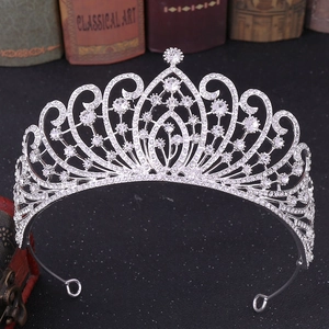 Detailed macro of a silver bridal crown featuring brilliant water-drop shaped rhinestones