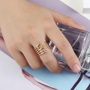 Gold multi-layer open ring featuring five thin bands accented with round clear crystals