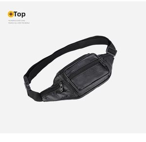 Detail view of the black pebbled PU leather waist bag featuring multiple zipper pockets