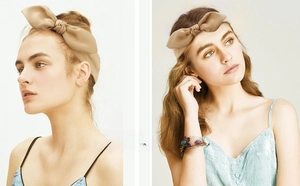 Detailed view of beige chiffon bow headband featuring a twisted knot and elastic stretch