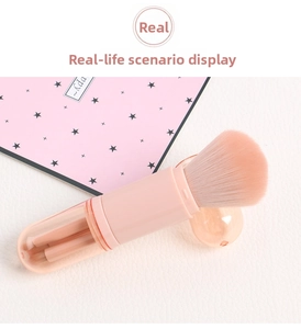 Macro view of portable 4-in-1 pink telescopic makeup brush set on leather texture