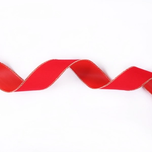 Macro detail of red velvet Christmas ribbon with golden edges and smooth satin texture