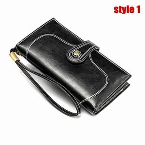 Detail of black oil wax genuine leather long wallet with wristlet and metal snap closure