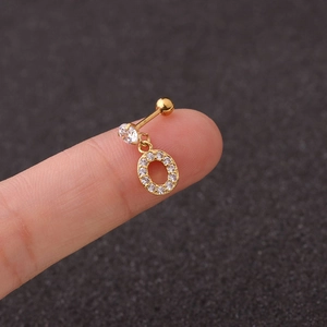 Detail view of a gold-plated letter O earring with zircon studs and screw back