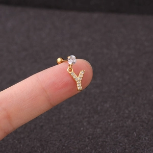Detailed view of a gold 26-letter Y earring with sparkling zircon stones and round gem