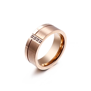 Rose gold brushed stainless steel wide ring featuring four embedded diamonds
