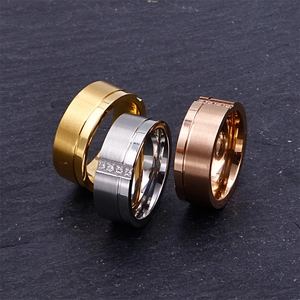 Brushed titanium steel rings in gold, silver, and rose gold with diamond accents