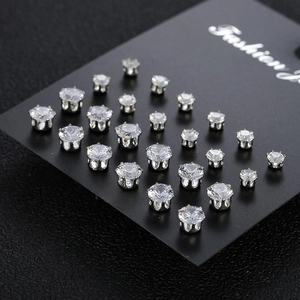Sparkling 12-pair silver zircon stud earring set displayed on a professional black card