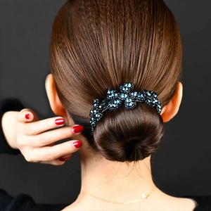 Elegant hair bun maker with blue rhinestones floral pattern on model hairstyle