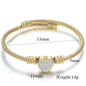 Detail view showing 55mm diameter golden cable wire bracelet with 11mm crystal heart charm