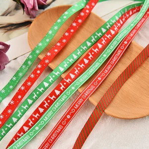Christmas themed grosgrain ribbons with snowflakes and reindeer for festive gift wrapping