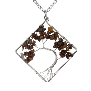 Close-up of handmade wire-wrapped Tree of Life pendant with natural tiger eye stones