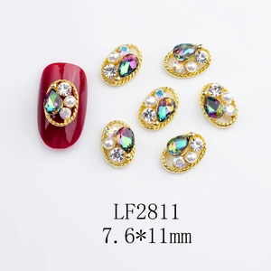 Detailed view of K9 alloy nail art gems with gold hollow frames and opal water drops