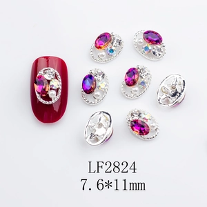 Detail view of nail charm LF2824 with red stone and pearls on silver alloy frame