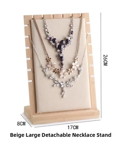 Detail of large removable beige velvet necklace display stand with bamboo frame