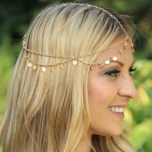 Close-up of bohemian gold double-layer head chain with shimmering round sequins