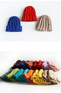 Detailed view of ribbed knit beanies in multiple vibrant colors and soft texture