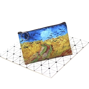 Detail view of the artistic oil painting print and metal ring on the mini coin pouch