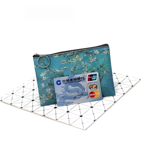 Detailed view of canvas coin purse with Van Gogh art and metal ring hook
