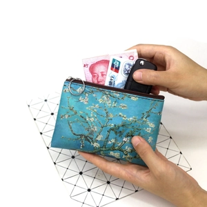 Detail view of almond blossom oil painting coin purse holding cards, cash and keys